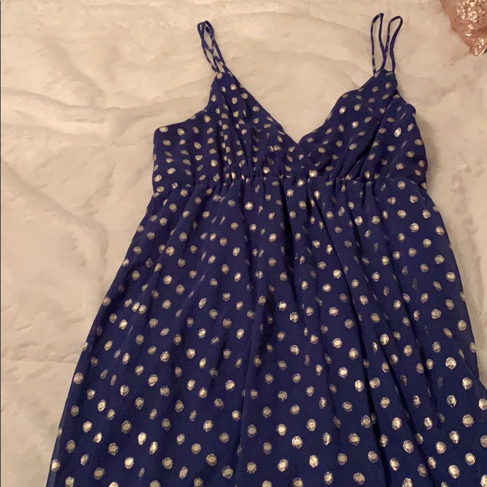 Sleeveless blue dress with gold polka dots